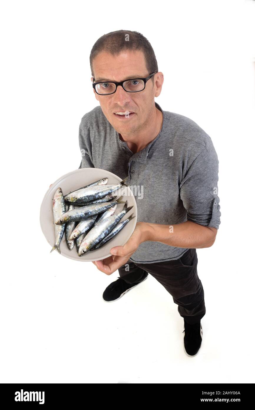 man with sardine on white background Stock Photo Alamy