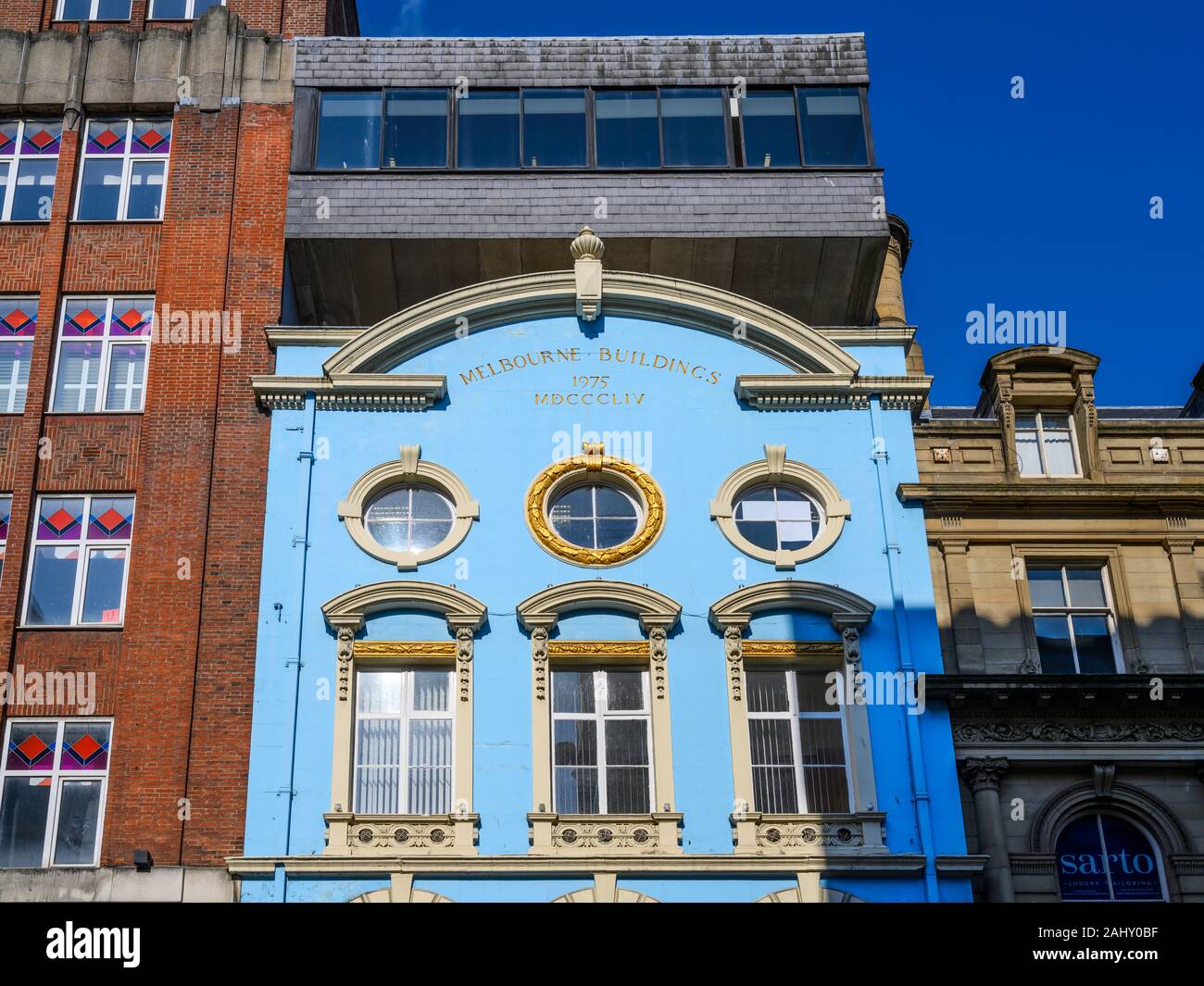 Melbourne Buildings (1854) in North John Street, Liverpool, is a Grade II listed building.  It has an ugly modern extension added in 1975. Stock Photo