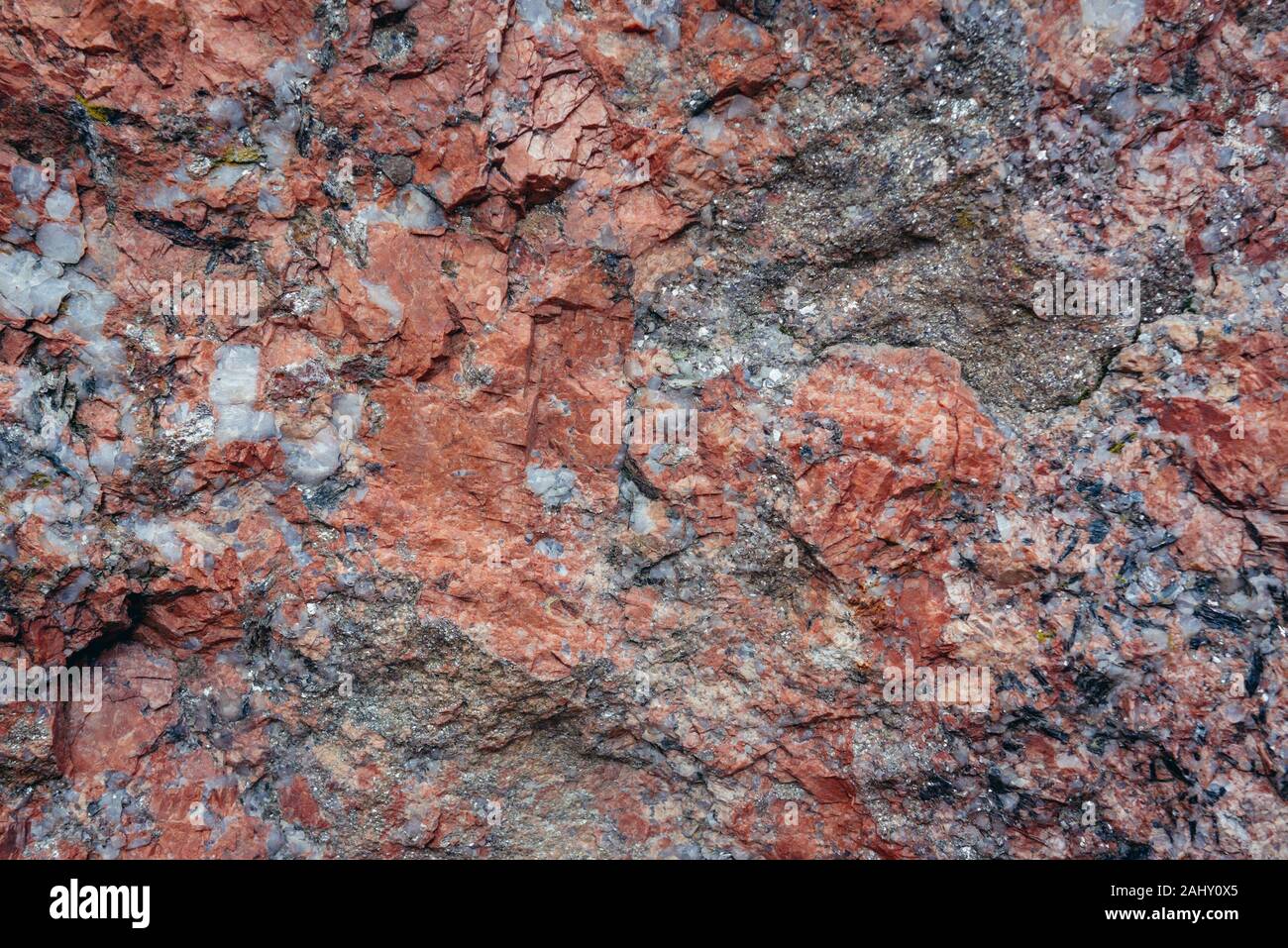 Close up on a Pegmatite rock with interlocking crystals in Poland Stock