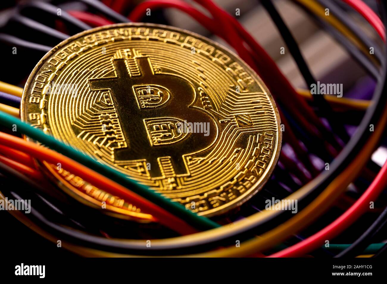 The golden bitcoin on colorful board background, Conceptual image for  worldwide crypto currency, huge stack physical version of golden Bitcoin  Stock Photo - Alamy