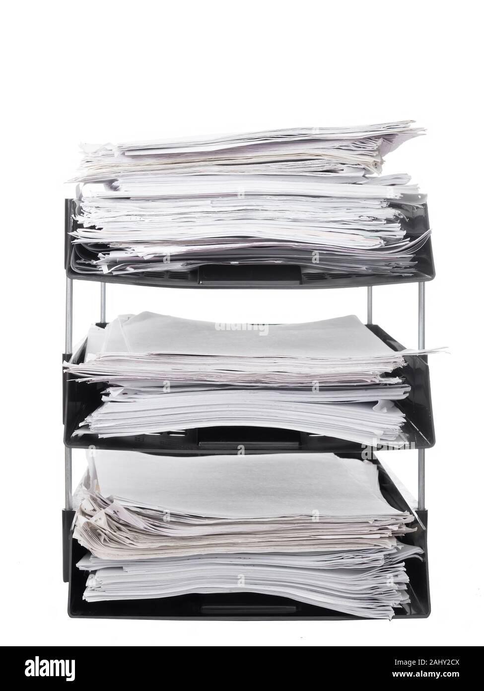 Office paper filing trays isolated on white background. Lots of paperwork, work, bureaucracy. Stock Photo