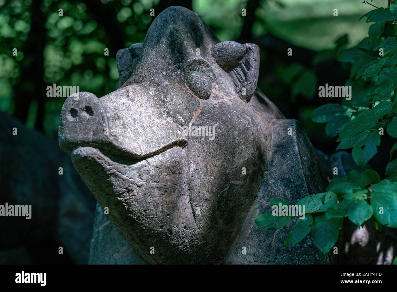Stone sculpture of a boar in a park at Gaerten der Welt, Berlin, Germany. Stock Photo