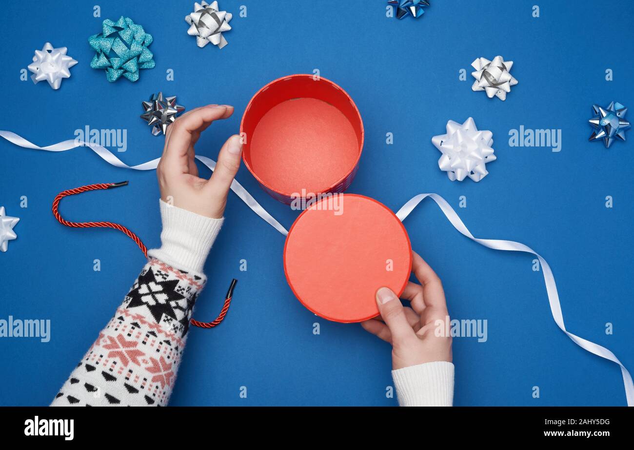 Empty Open Red Cardboard Box Female Hands Hold The Lid Blue