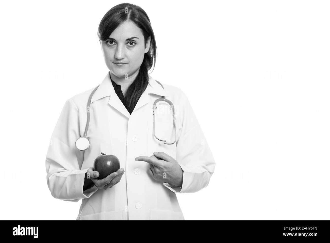 Portrait of beautiful woman doctor as nutritionist with apple Stock Photo