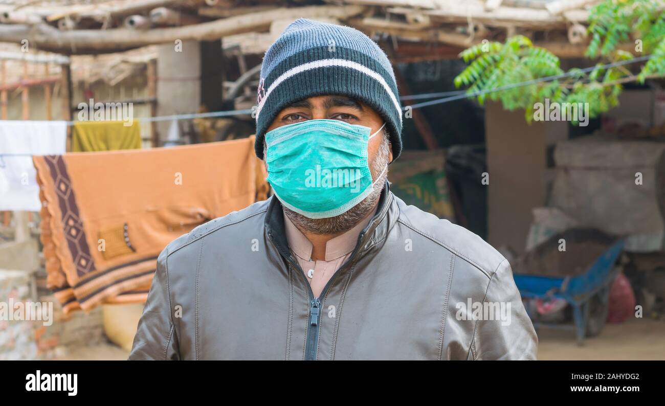 a man wearing face mask for the protection of air pollution and pollen allergy.front view Stock