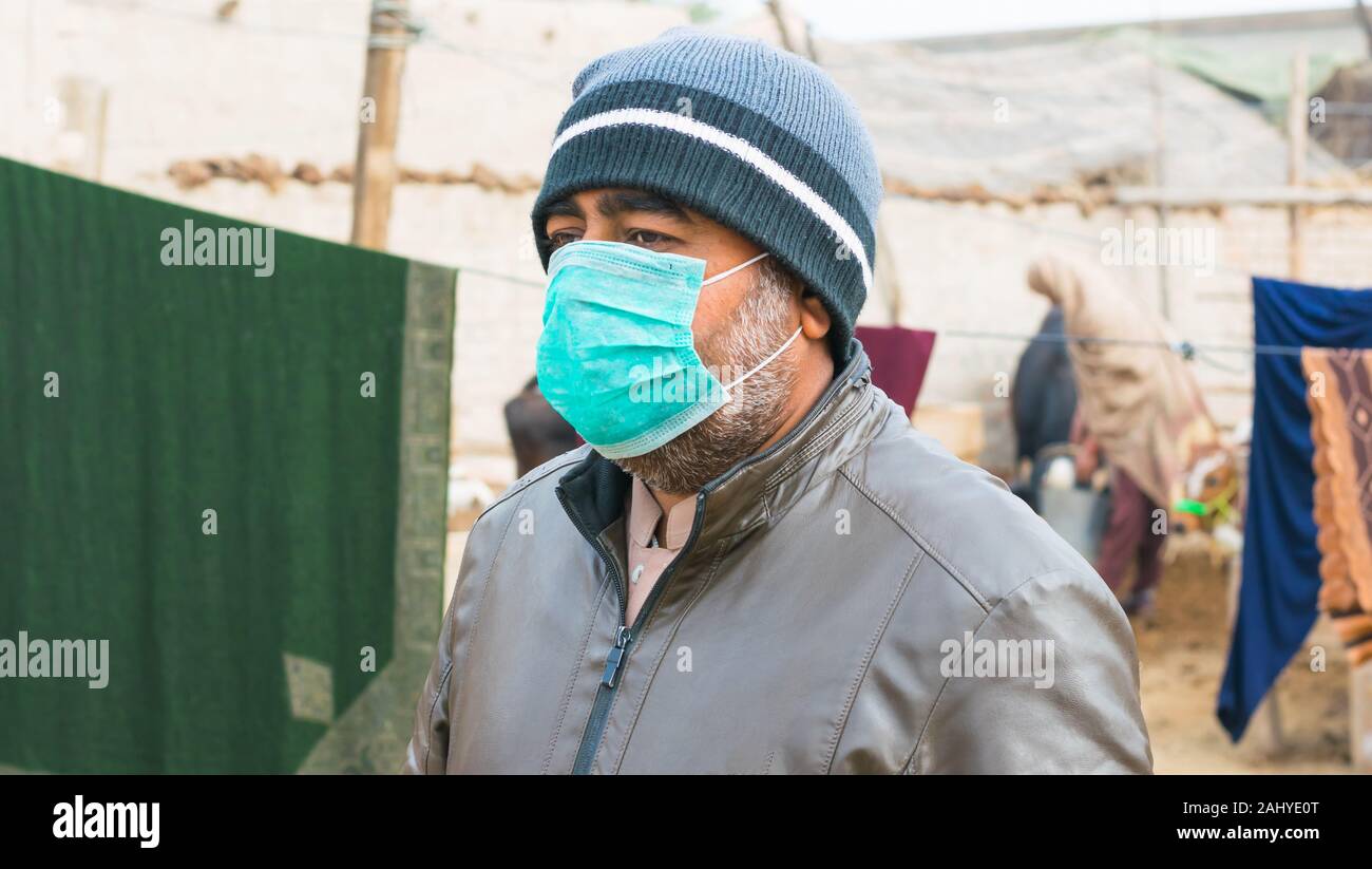 a man wearing face mask for the protection of air pollution and pollen
