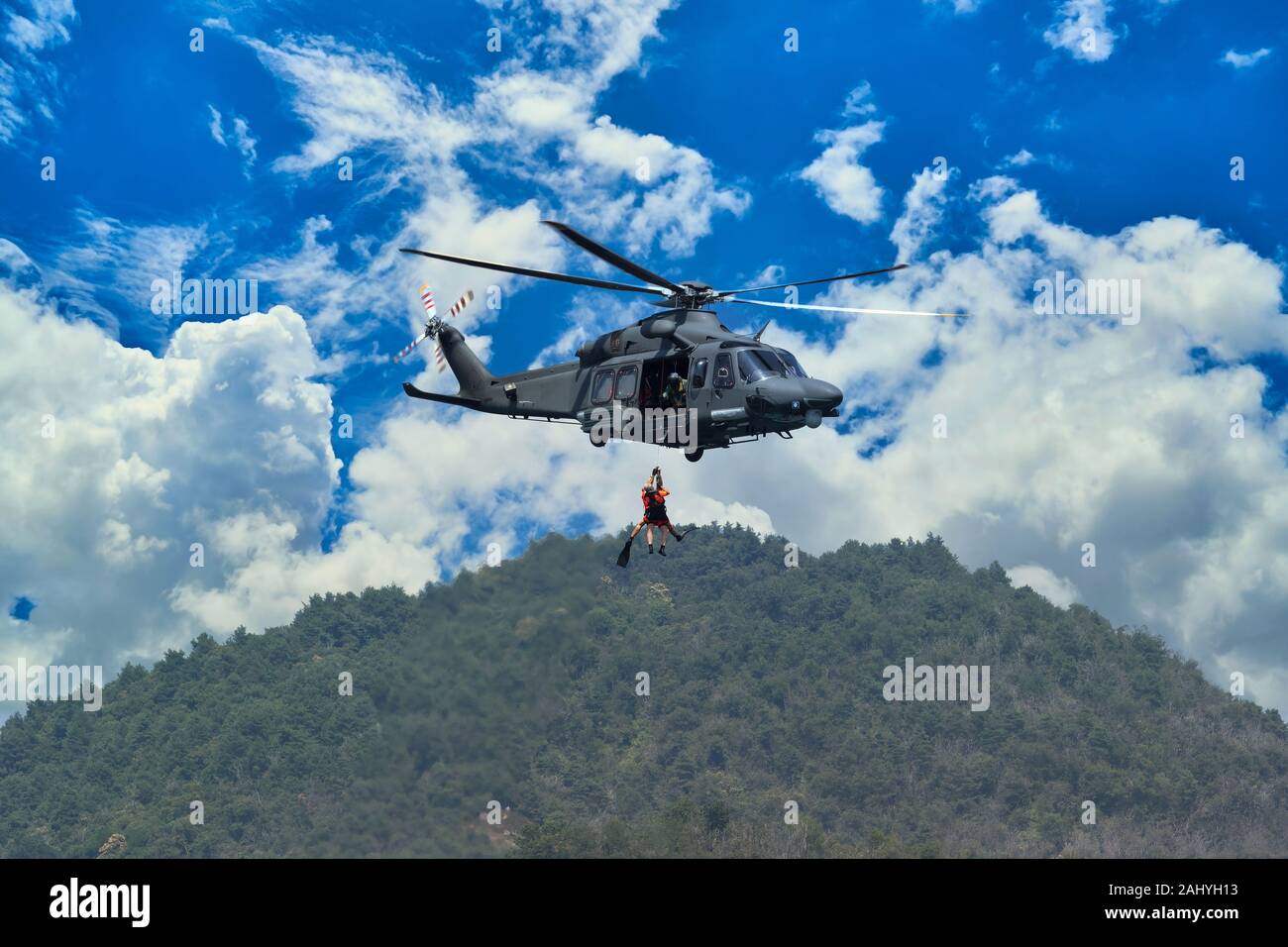 A low altitude military helicopter Stock Photo