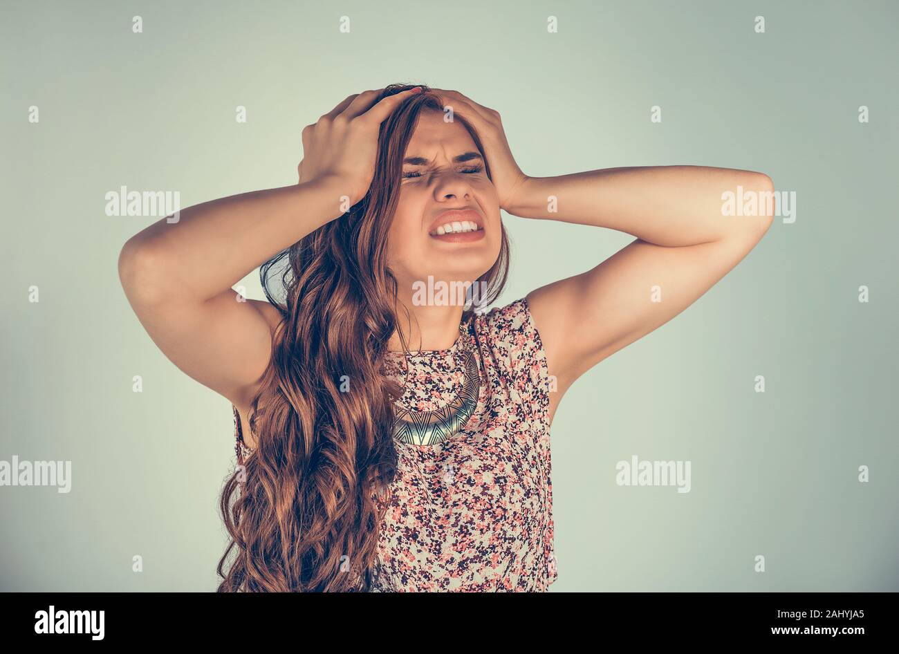 Closeup portrait young unhappy stressed woman covering her ears eyes