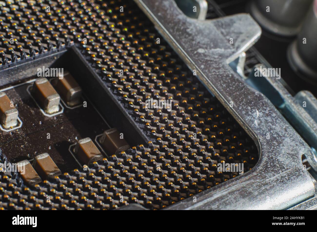Empty CPU socket. Detailed photo of the place for the central processor. Upgrade a modern computer. Macro shot. Clever focus. Without people Stock Photo