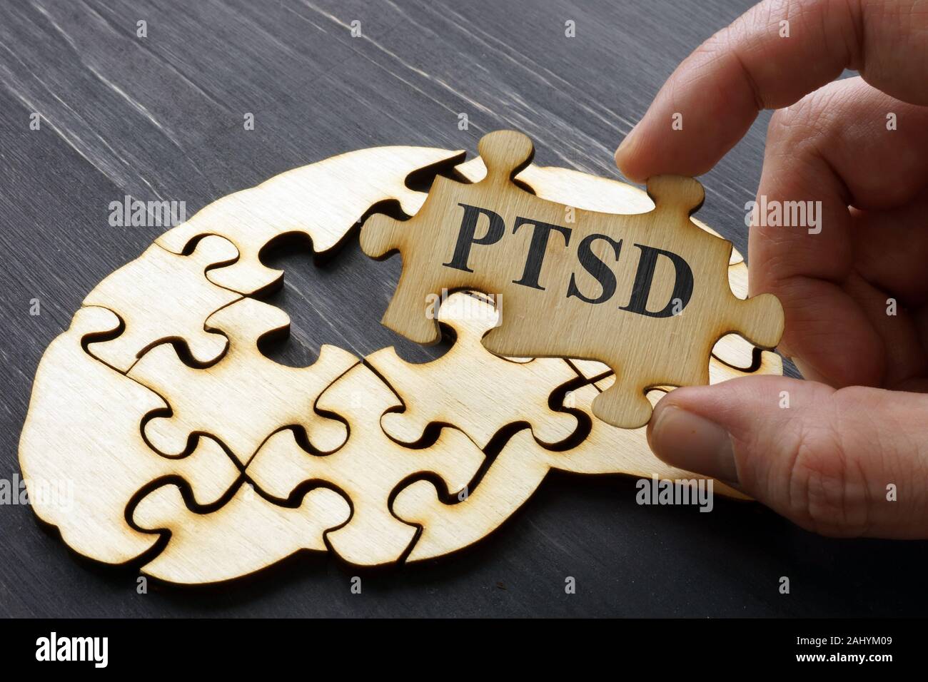 PTSD Post Traumatic Stress written on the puzzle. Stock Photo