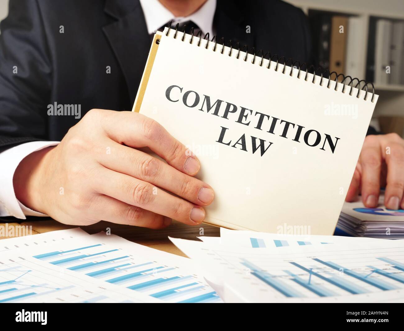 Lawyer is holding competition law book. Stock Photo