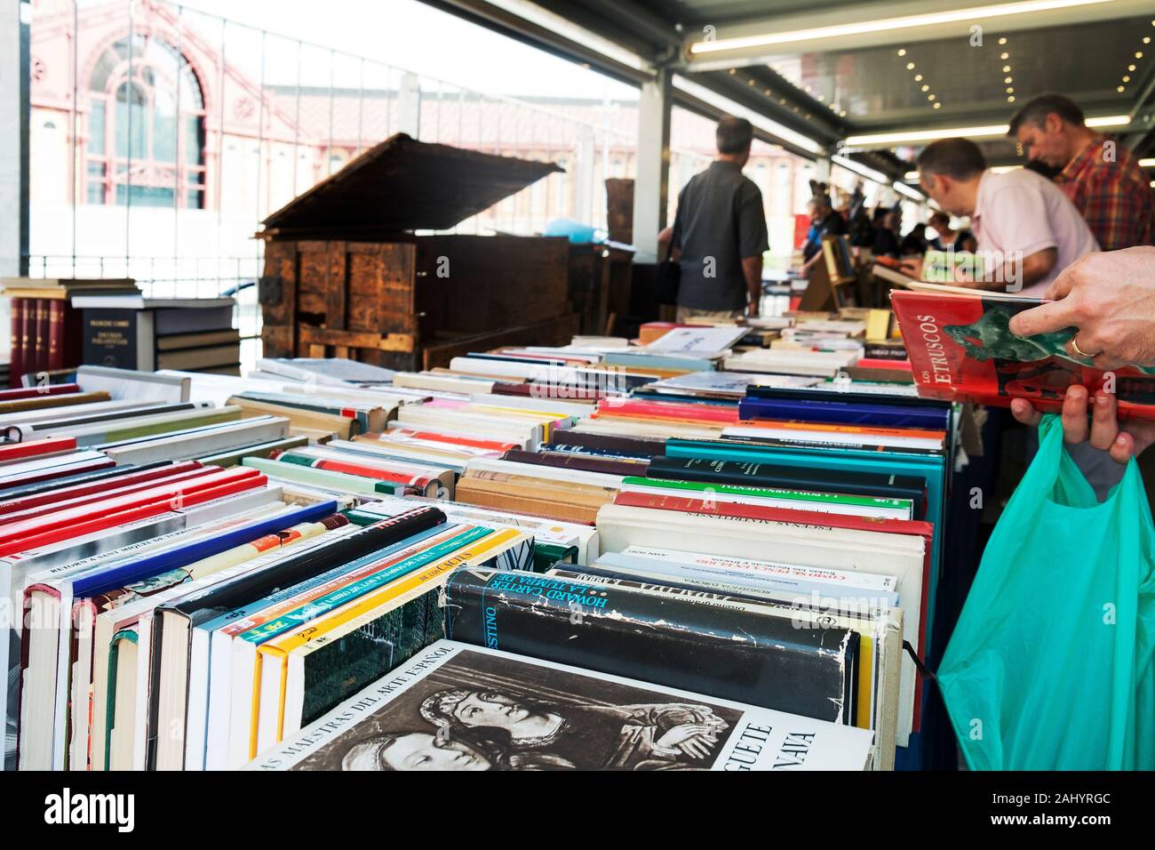 BARCELONA, SPAIN - JULY 15, 2018: Customers at the stalls of the secondhand book market at the Mercat de Sant Antoni public market in Barcelona, Spain Stock Photo