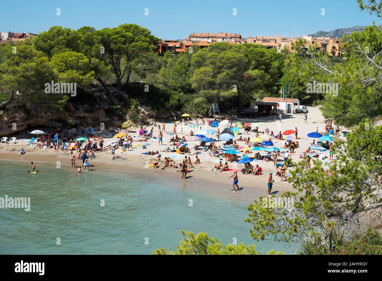AMETLLA DE MAR, SPAIN - AUGUST 26, 2018: Vacationers at the Cala Calafato beach in Ametlla de Mar, Spain, in the popular Costa Daurada coast Stock Photo