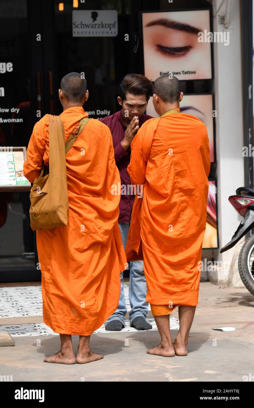 Buddhist monks on their morning alms round,Siem Reap ,Cambodia,South Esat Asia. Stock Photo