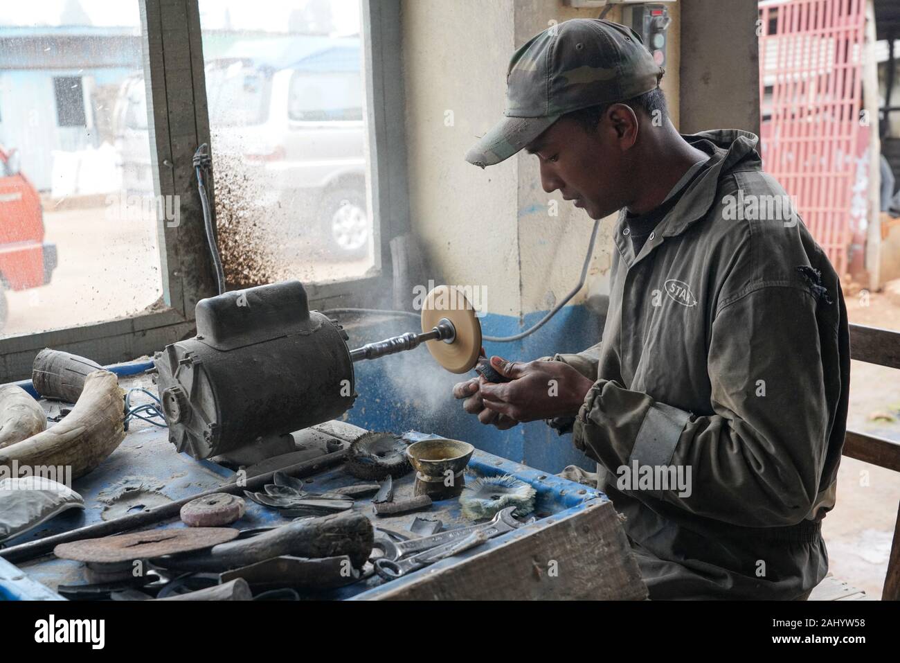 Craftsman working zebu horns, Antsirabe, Central Madagascar Stock Photo