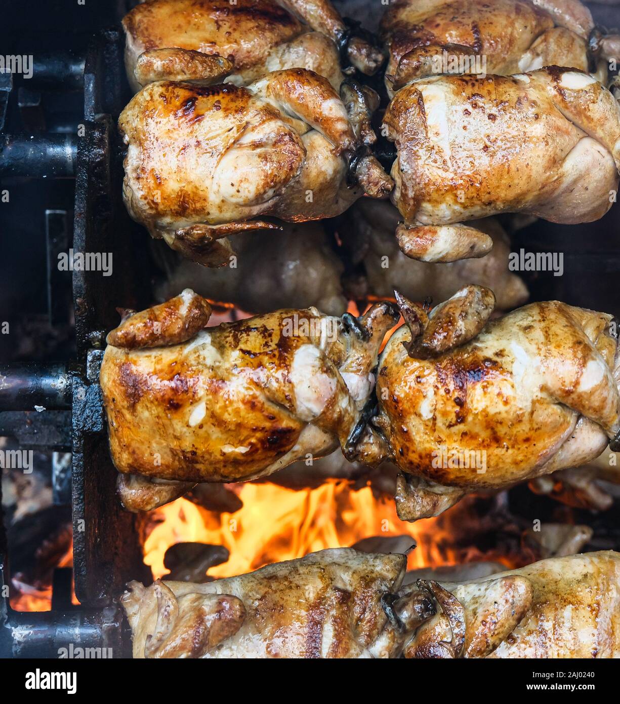 Spit roasted chickens hi-res stock photography and images - Alamy