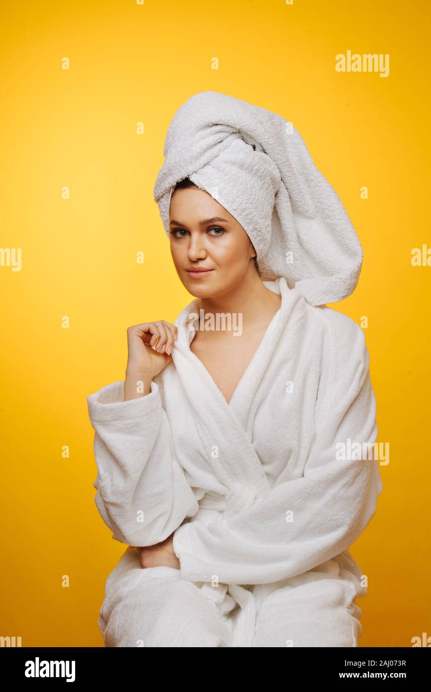 Woman wearing bathrobe towel head hires stock photography and images