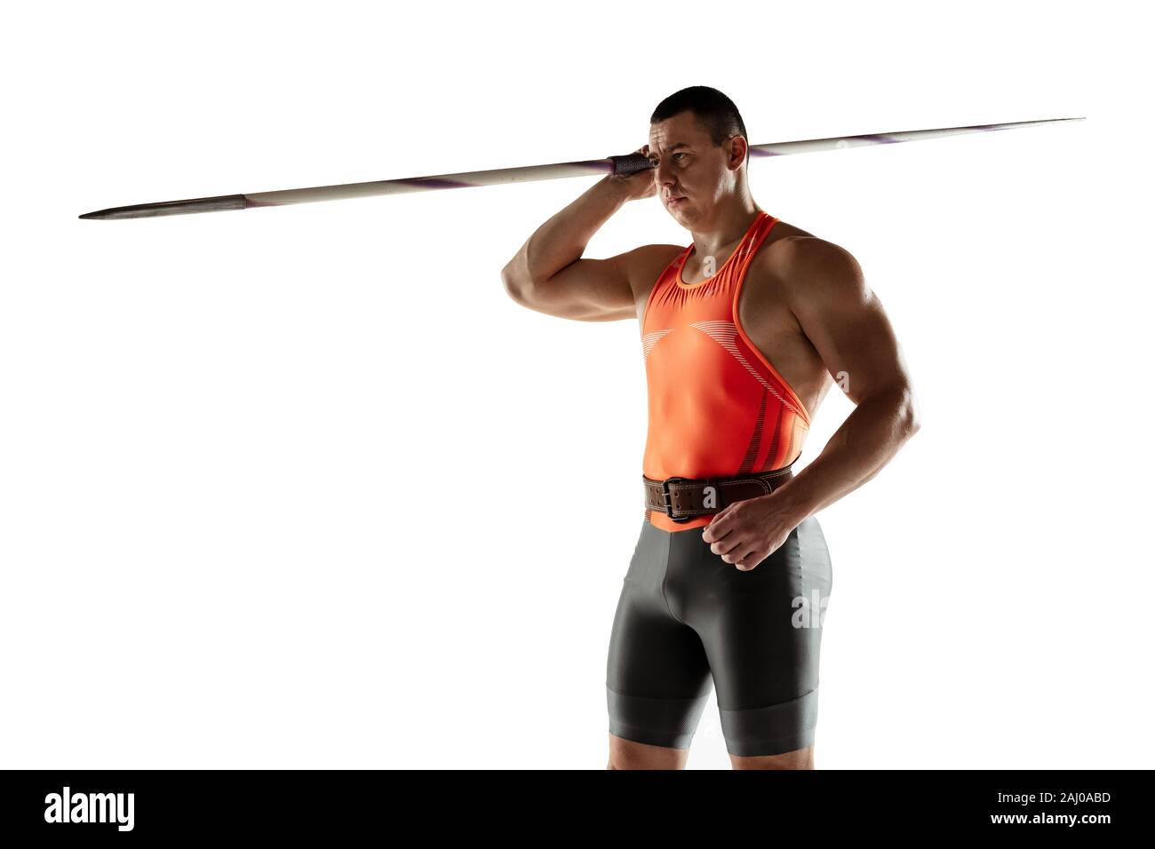 Male athlete practicing in throwing javelin isolated on white ...