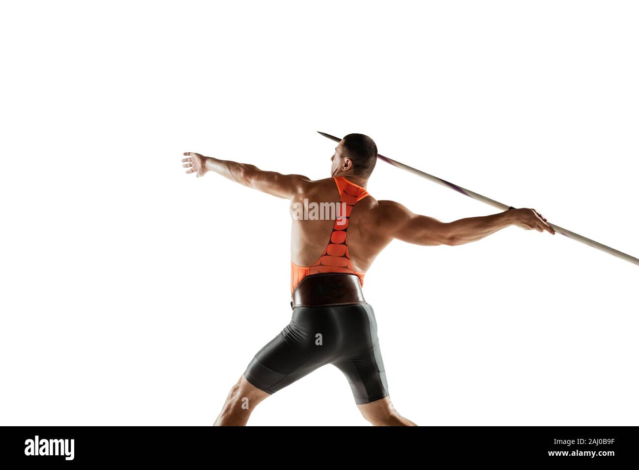 Male athlete practicing in throwing javelin isolated on white studio ...