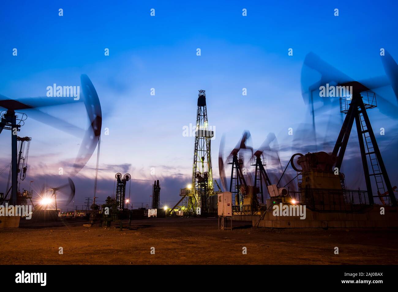 In the evening of oilfield derrick Stock Photo Alamy