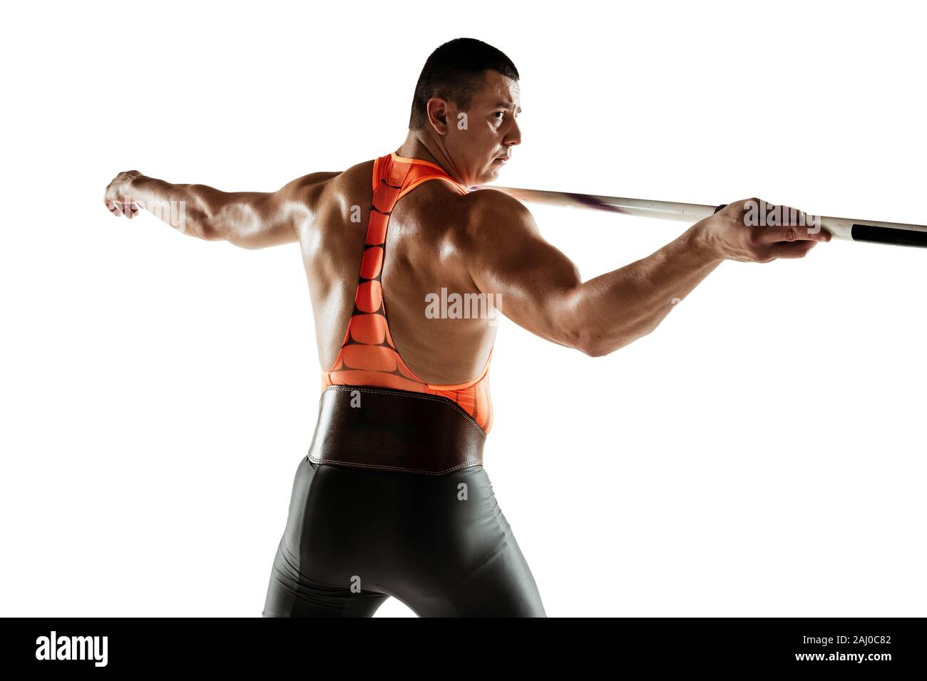 Male athlete practicing in throwing javelin isolated on white studio ...