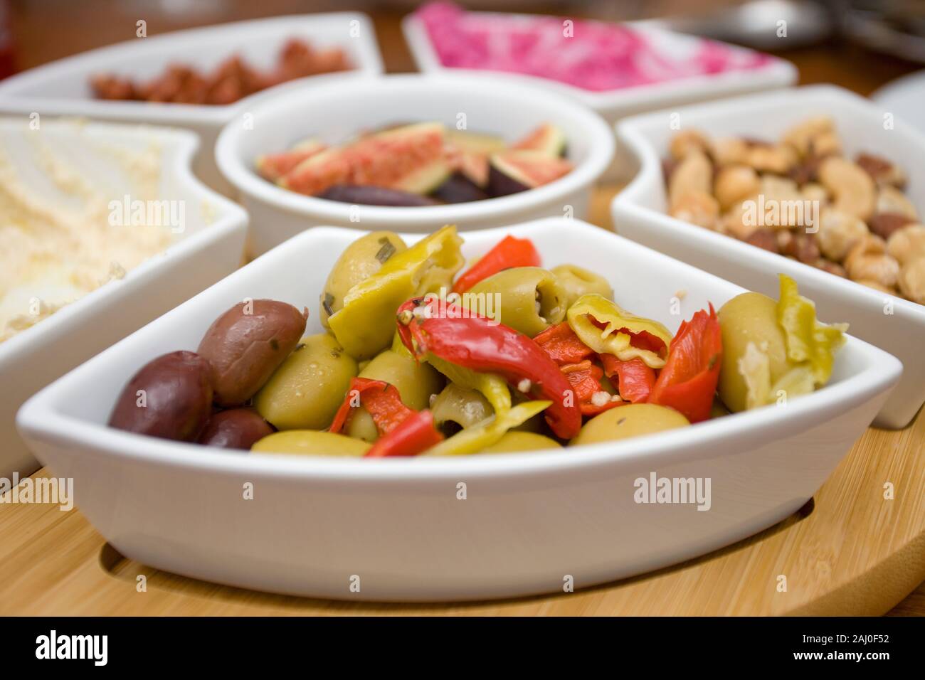 Lazy Susan with a variety of fresh foods on table Stock Photo