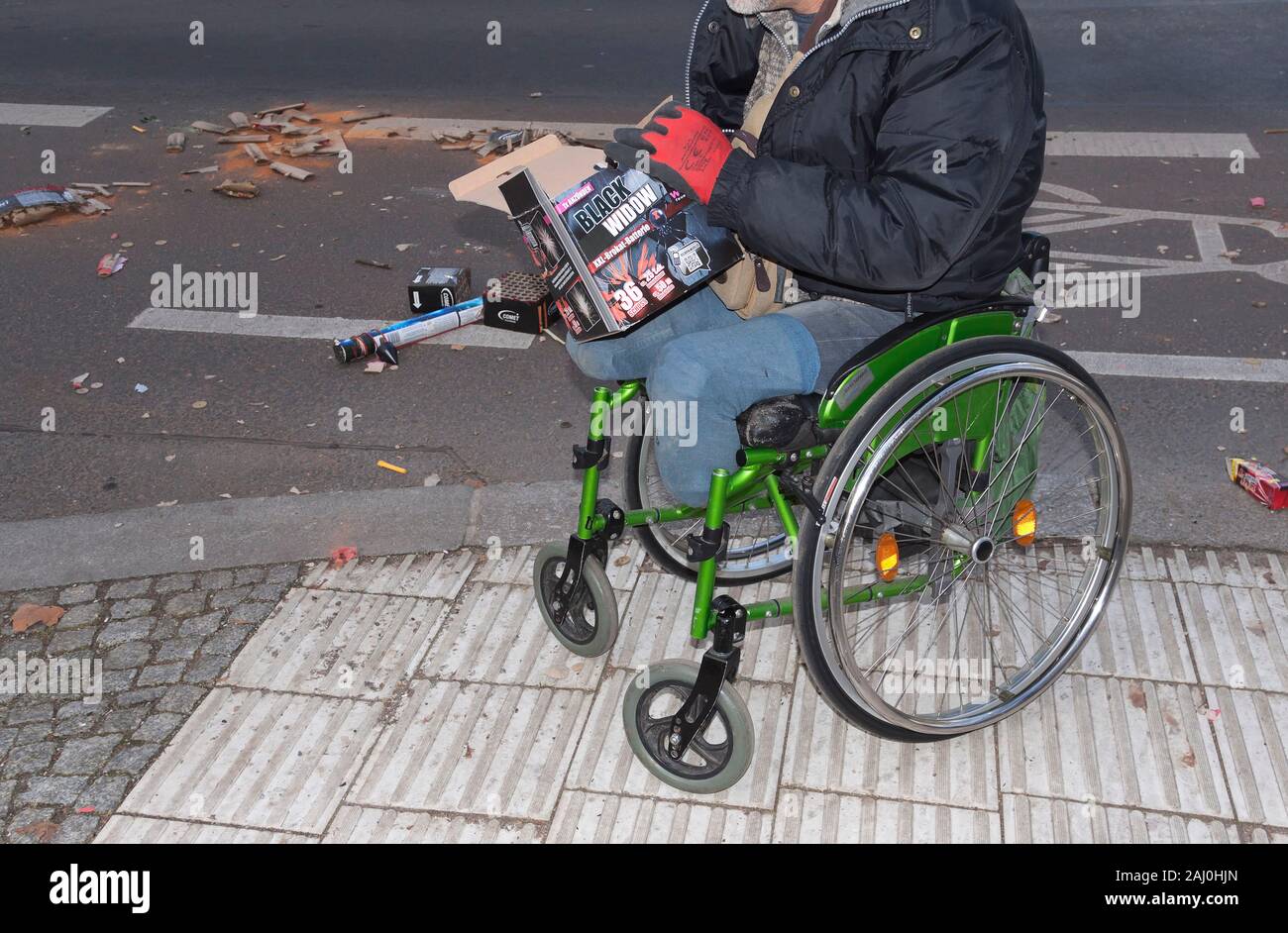 Man in a wheelchair who lost his feet in an explosion 2 years ago Stock ...