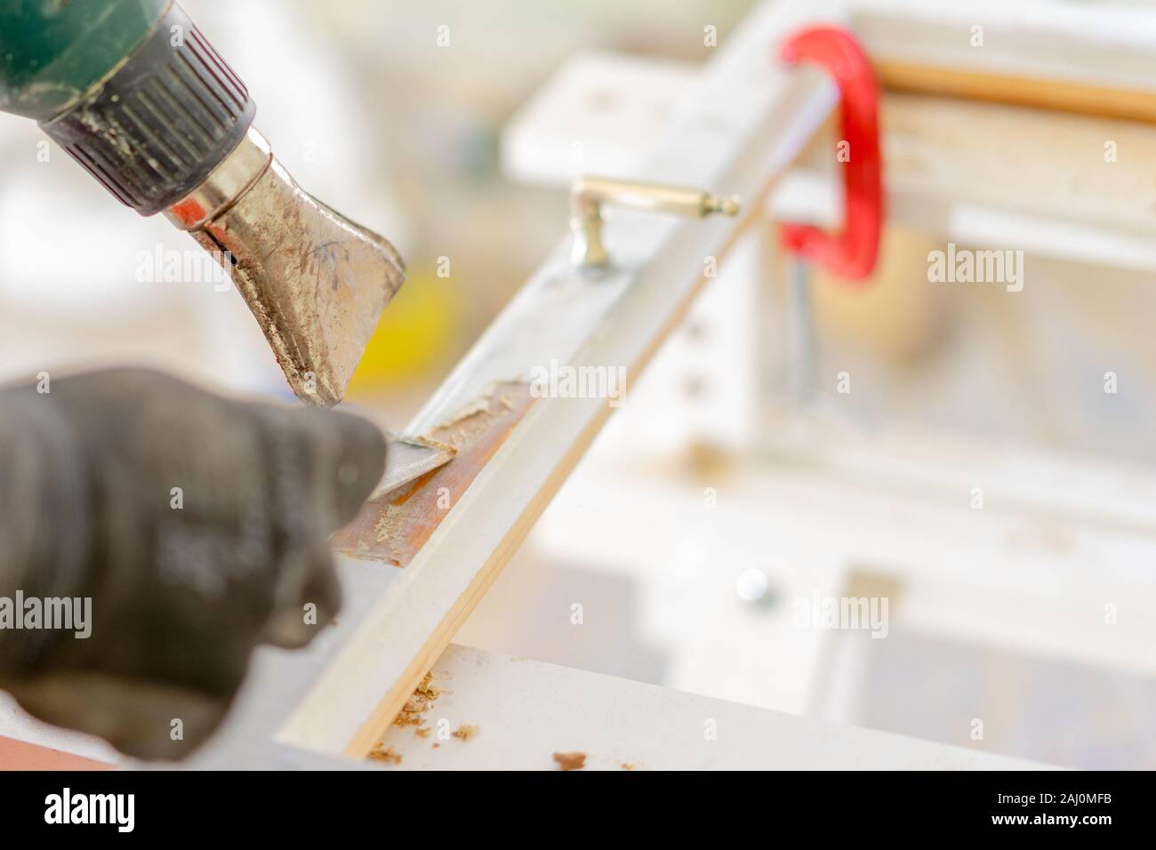 On the site an old window is restored, the old paint is removed Stock Photo