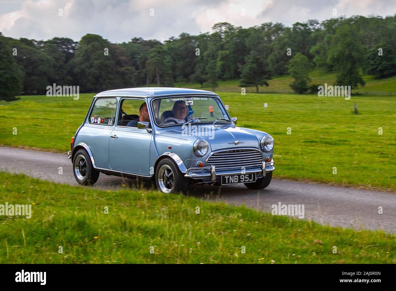 1986 80s blue Mini 1000 City E; 80s Classic cars, historics, cherished, old timers, collectable restored vintage veteran, 1980s vehicles of yesteryear arriving for the Mark Woodward historical motoring event at Leighton Hall, Carnforth, UK Stock Photo