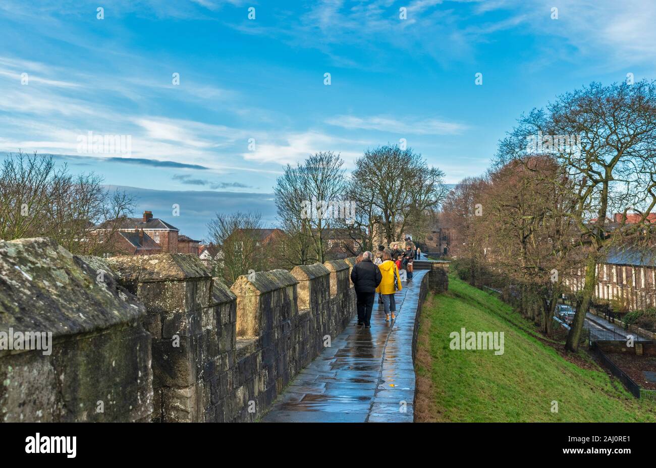 YORK ENGLAND GROUP OF WALKERS ON THE WALLS AT BAILE HILL HEADING