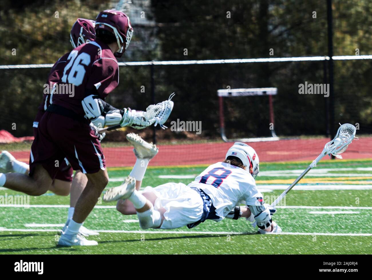 During a high school lacrosse game, a player gets pushed down and the