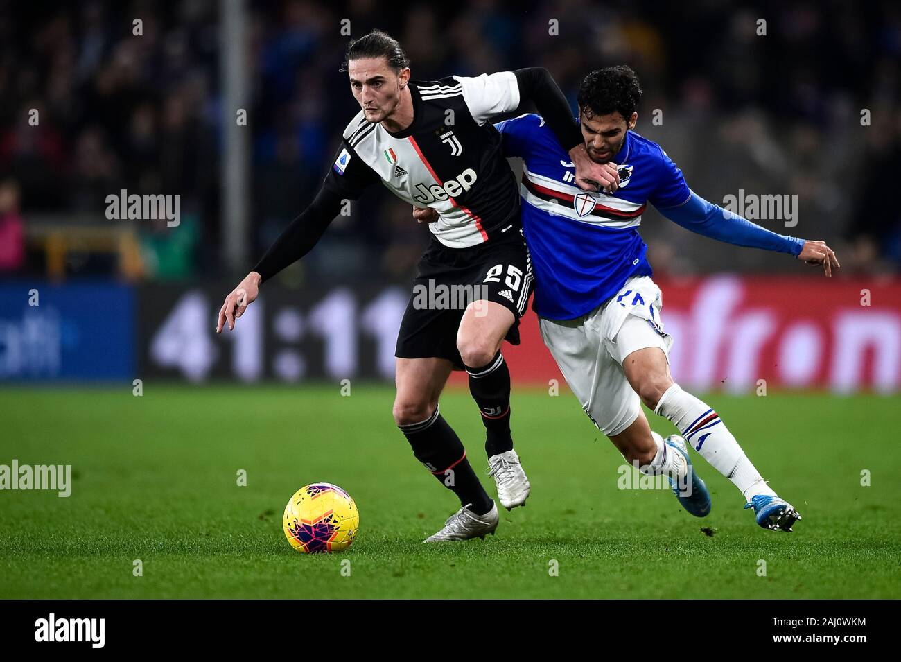 Genoa, Italy. 18th December, 2019: Adrien Rabiot (L) of Juventus FC is challenged by Mehdi Leris of UC Sampdoria during the Serie A football match between UC Sampdoria and Juventus FC. Juventus FC won 2-1 over UC Sampdoria. Credit: Nicolò Campo/Alamy Live News Stock Photo