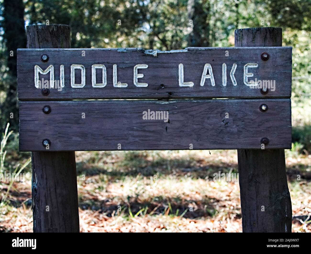 Conroe, TX USA - 11/15/2019  -  Middle Lake Wooden Sign Stock Photo