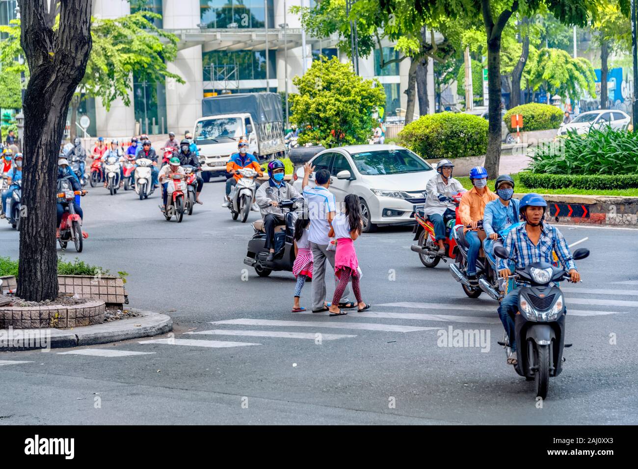 Crossing the road in Ho Chi Minh City, Vietnam 