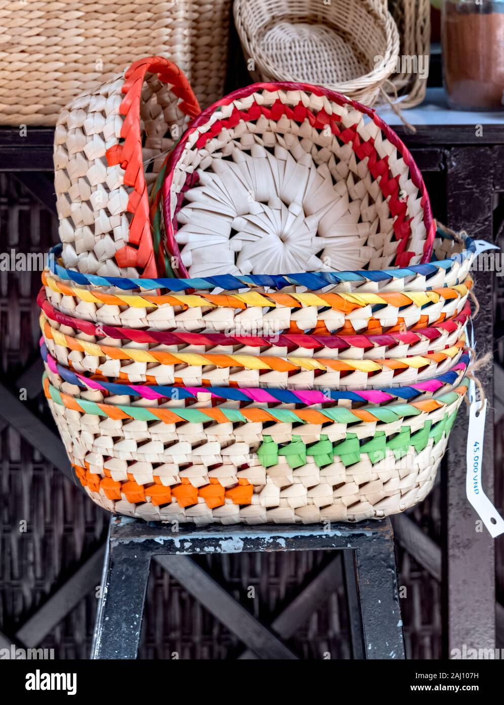 Colourful woven bamboo baskets for sale Ben Tre Province Vietnam Stock Photo