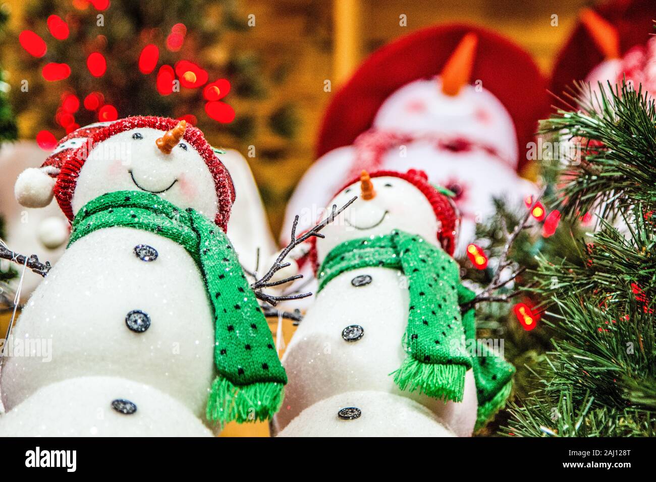 Christmas Shopping. Interior of store with Christmas lights and group of snowman for sale. Stock Photo