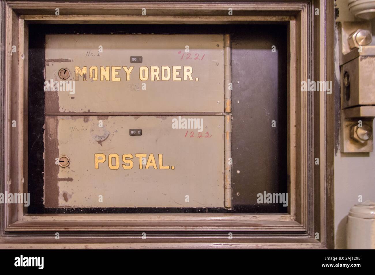 Antique Post Office Box. Rusty retro close up of Post Office boxes in horizontal orientation. Stock Photo