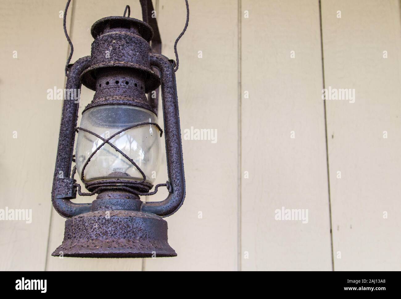 Antique Lantern. Rusted antique lantern in horizontal orientation with copy space. Stock Photo