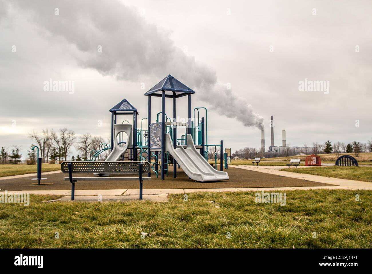 Billowing smokestack fills the sky with a playground at the Sterling