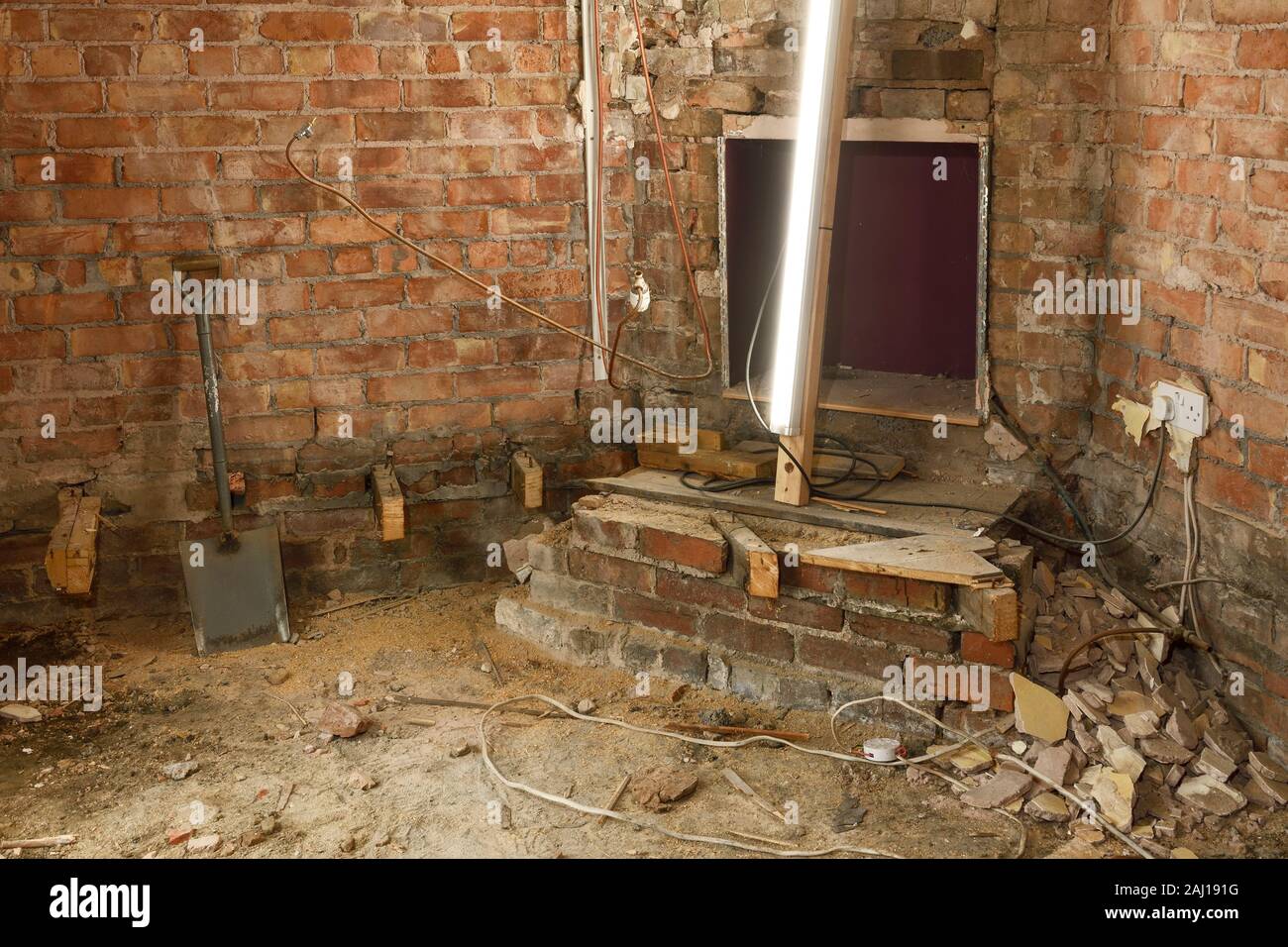 Detail Of A 1930s Property In The Uk Undergoing Extensive Renovation Work With Walls Stripped Back To Brick And A Suspended Timber Floor Removed Stock Photo Alamy
