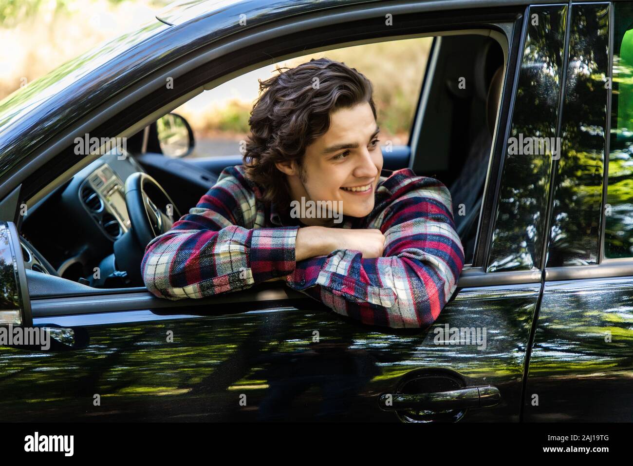 Portrait of an handsome guy driving his car Stock Photo - Alamy