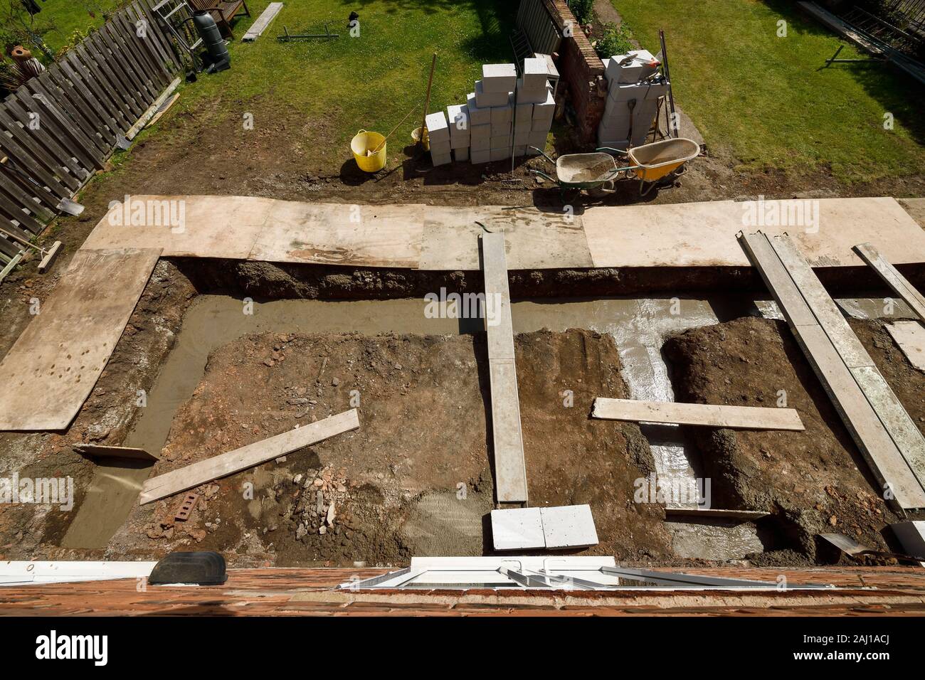 The freshly poured concrete foundation slab for a rear extension project at a house in Cheshire UK Stock Photo