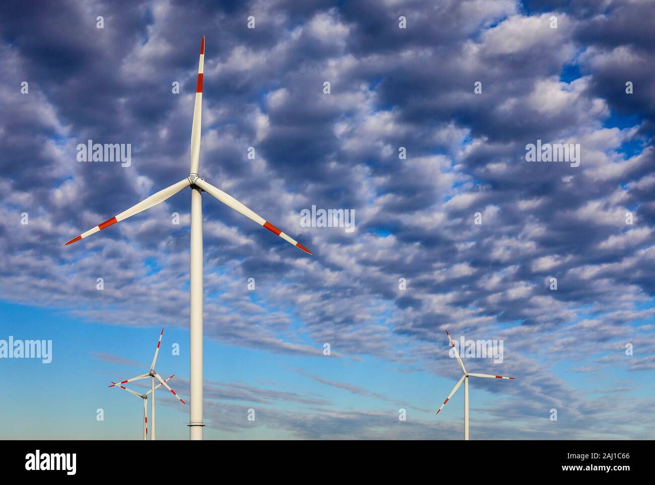 Juechen, North Rhine-Westphalia, Germany - Wind turbines against a sky with clouds. Juechen, Nordrhein-Westfalen, Deutschland - Windraeder vor Himmel Stock Photo