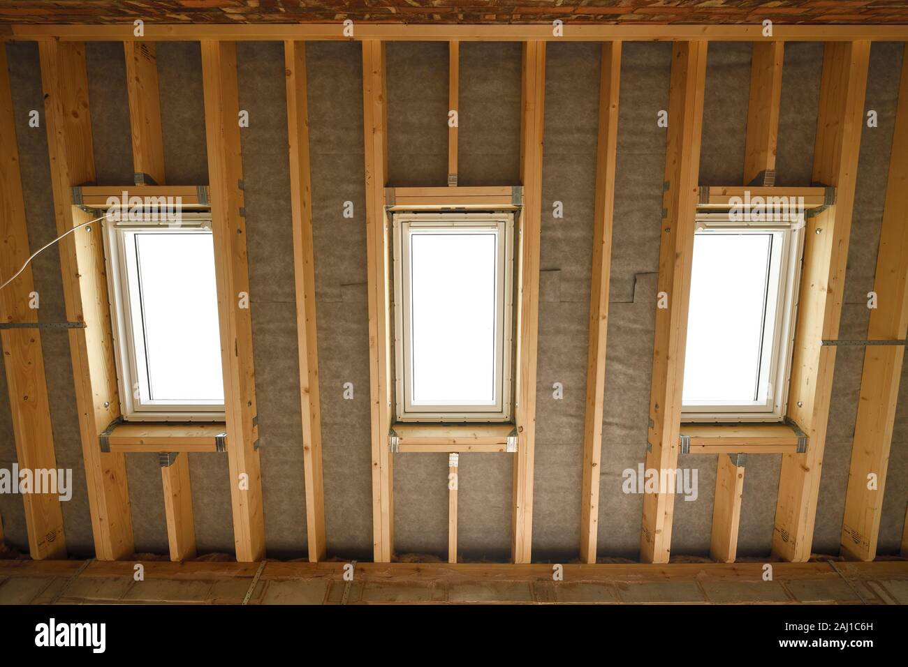 Velux roof windows installed in a newly constructed roof structure as part of a home extension in the UK Stock Photo