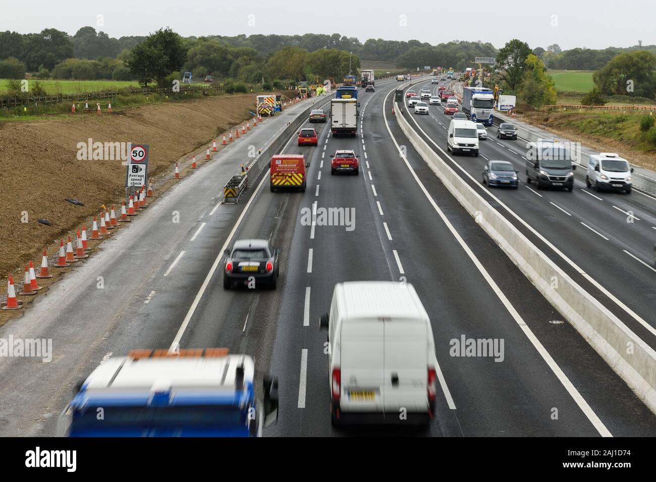 Traffic driving through the roadworks on the M4 motorway near Reading UK Stock Photo