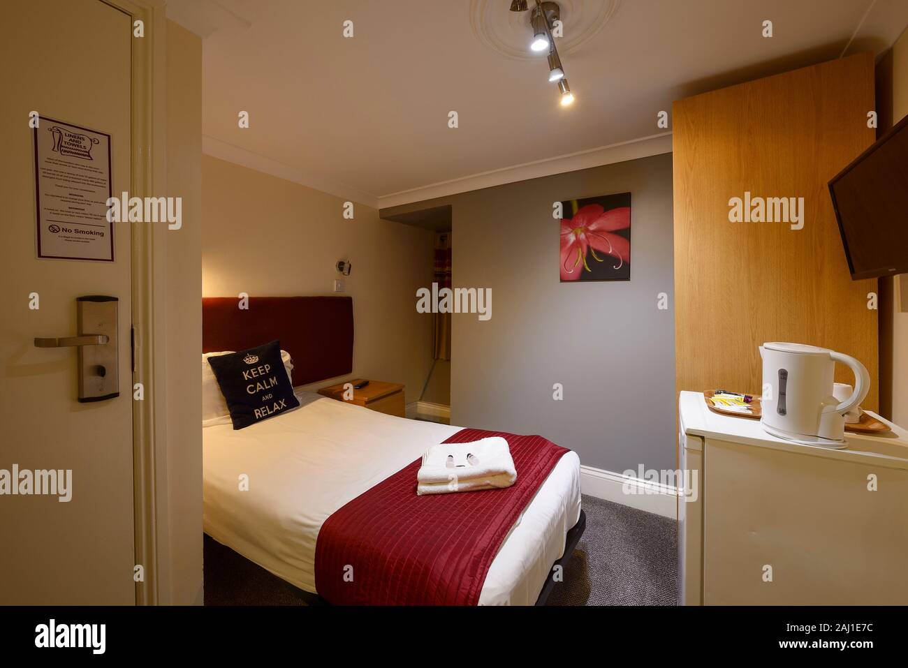 Interior of a single bedroom in a budget hotel in Hammersmith London UK Stock Photo