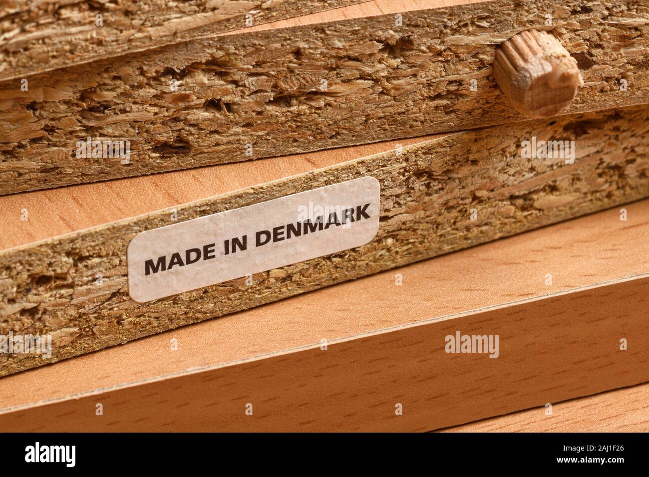 Close up detail of a label on some flat pack chipboard furniture indicating Made In Denmark Stock Photo