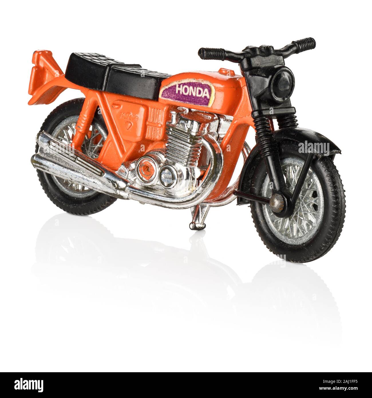 A vintage retro orange toy Honda motorbike Stock Photo