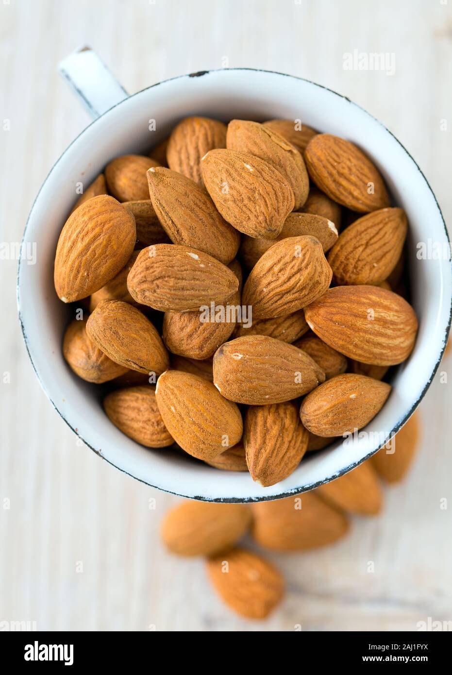 almonds on wooden surface Stock Photo