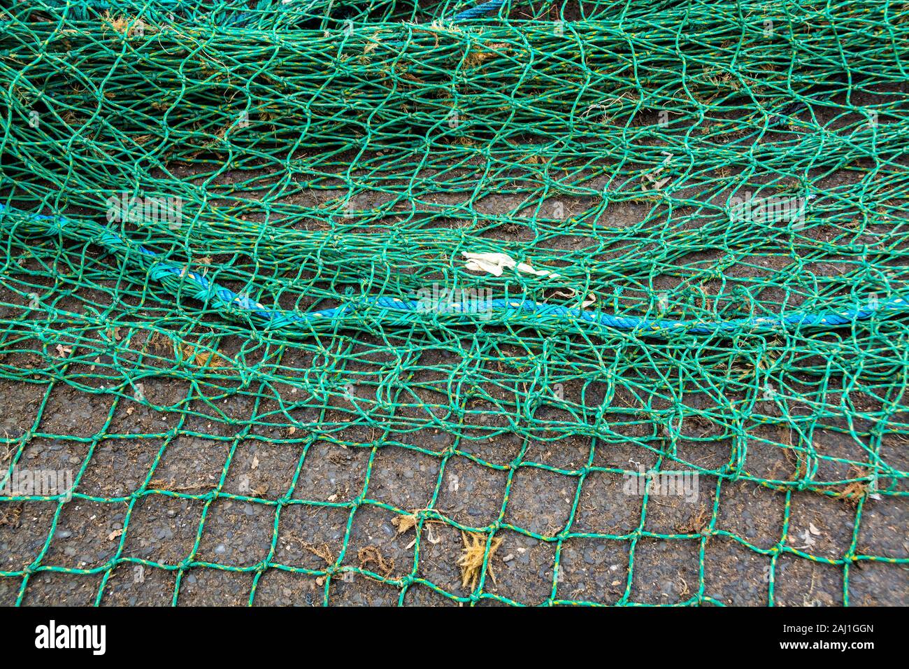A section of fishing net on the ground Stock Photo - Alamy